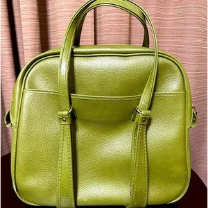 Vintage Samsonite overnight bag in olive green. Classic bowling bag shape.